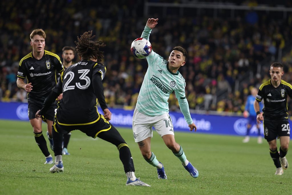 Nov 12, 2023; Columbus, Ohio, USA; Atlanta United FC midfielder Thiago Almada (10) battles for the ball against Columbus Crew defender Mohamed Farsi (23) during the second half at Lower.com Field. Mandatory Credit: Trevor Ruszkowski-USA TODAY Sports